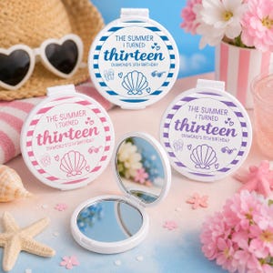 May include: Four round white compact mirrors with hinged lids. Three mirrors are closed, featuring blue, pink, or purple striped borders and the text "THE SUMMER I TURNED thirteen DIAMOND'S 13TH BIRTHDAY" with seashell, flip-flop, and heart icons.