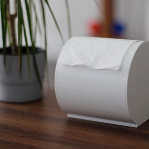 Distributeur/support de papier toilette de table |