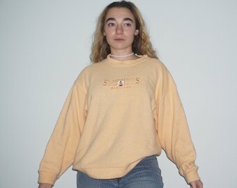 pastel yellow sweatshirt