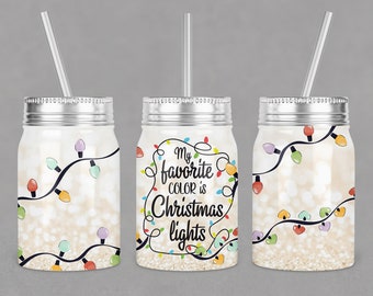 May include: Three silver mason jars with lids and straws. Each jar has a different design featuring a string of colorful Christmas lights on a sparkly background. The middle jar has the text "My favorite color is Christmas lights".