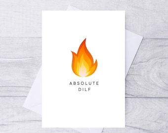 May include: A white card with a red and orange flame illustration and the text "ABSOLUTE DILF" in black.