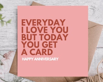 May include: A pink card with the text "EVERYDAY I LOVE YOU BUT TODAY YOU GET A CARD HAPPY ANNIVERSARY" in brown text.