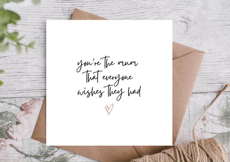 May include: White card with black calligraphy that reads "You're the mum that everyone wishes they had" with a pink heart.