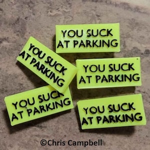 Borden met zuignap van You Suck At Parking