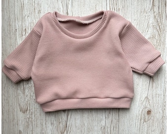 Baby, children's pullover Sweater made of knitted fabric in old pink