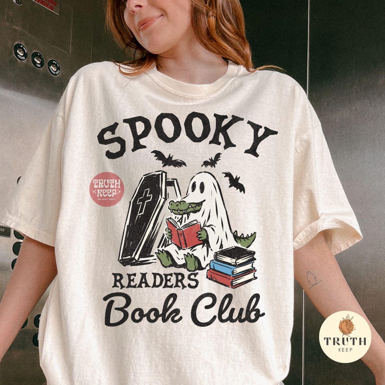 halloween book lover png for sublimation, spooky ghost alligator reading design, retro readers book club shirt png, cute crocodile in ghost costume clipart, funny gator bookworm digital artwork, halloween reading club graphic, ghost reader with coffin and stacked books, spooky season bookish png, librarian halloween gift design, horror reader digital download, transparent png for t shirts hoodies mugs tumblers tote bags bookmarks stickers signs dtf transfers and handmade products, halloween gift
