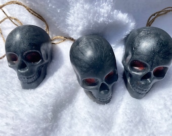 Black skull soaps on a rope with red eyes
