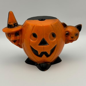 Vintage Halloween 1950s hard plastic candy container. Rosbro