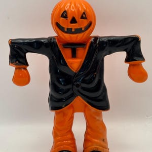 Vintage Halloween 1950s Hard plastic Scarecrow JOL Candy holder. Rosbro