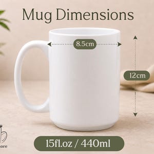 May include: A white ceramic mug with a curved handle. The mug is 8.5cm wide and 12cm tall, holding 15 fl oz. The text "Mug Dimensions" is at the top. The mug is labeled "SirMugsmore".