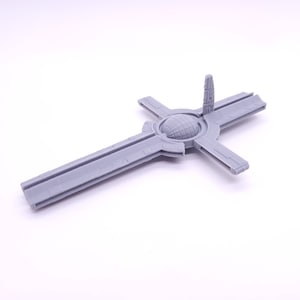 May include: A 3D printed model of a space station with a central hub and four arms extending out. The model is gray and has a detailed design.