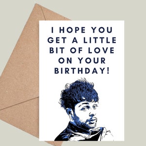May include: A white card with a blue and black illustration of a person with a beard and curly hair. The text on the card reads "I hope you get a little bit of love on your birthday!"