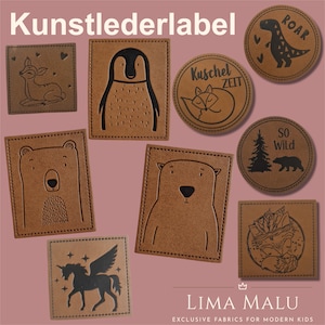 Könnte beinhalten: Ein Set aus neun braunen Lederpatches mit schwarzen Tierillustrationen. Die Patches zeigen einen Pinguin, ein Reh, einen Fuchs, einen Bären, ein Einhorn, einen Dinosaurier, eine Bergszene, eine Waldszene und einen Textpatch mit der Aufschrift "Kuschel Zeit".