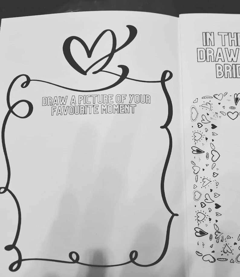 May include: A black and white drawing of a heart with a decorative frame around it. The text "DRAW A PICTURE OF YOUR FAVORITE MOMENT" is written inside the frame. The right side of the image is filled with a pattern of hearts.
