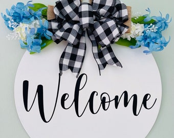 Welcome Door Hanger: Blue Flowers, Buffalo Plaid Bow, Birch Wood