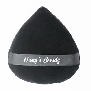 May include: Black teardrop-shaped makeup sponge with a grey ribbon that says "Huny's Beauty" in white lettering.