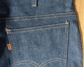 Jeans Levi's 684 0217 a zampa d'elefante con linguetta arancione, nuovi con cartellino, anni '70, taglia vintage Dead Stock 34 31