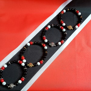 Trinidad & Tobago Gemstone Bracelet, with silver lion head, that&#39;s perfect to wear at Caribbean Carnival. Bead width 8mm. Various sizes.