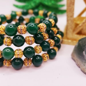 Green Agate bracelet with gold cubic zirconia spacers. Perfect birthday gift for a gift for the holidays. Bead width 8mm.