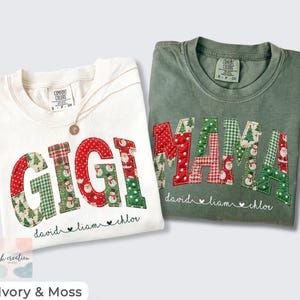 May include: An ivory t-shirt with the word GIGI and a moss green t-shirt with the word MAMA, both featuring quilted-style Christmas-themed fabric letters. Below the letters, the names David, Liam, and Chloe are printed in black script.