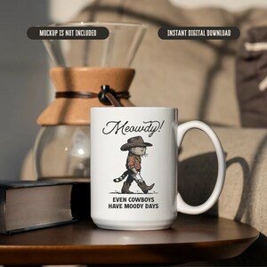 May include: White ceramic mug featuring a cartoon illustration of a cat dressed as a cowboy. The text "Meowdy! Even cowboys have moody days" is printed on the mug.