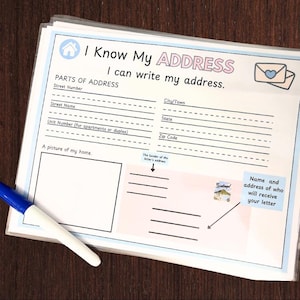 May include: A printable worksheet with a light blue background and pink accents. The worksheet is titled "I Know My Address" and includes a section for writing a full address, a space to draw a picture of a home, and a section for writing the name and address of the recipient of a letter.