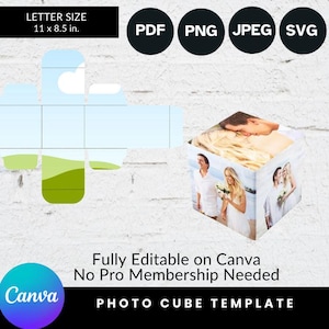 May include: A template for a photo cube, with a white background and a green and blue landscape design. The template is fully editable on Canva and does not require a Pro membership. The template is 11 x 8.5 inches.