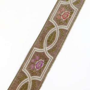 May include: A brown and white trim with a floral pattern. The trim features pink, red, and green flowers.