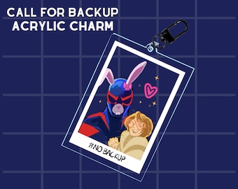 May include: Acrylic charm featuring a comic-style illustration of two characters, one with bunny ears and a mask, the other with glasses. The charm has a black clasp and the text "CALL FOR BACKUP ACRYLIC CHARM" and "#NO BACKUP".