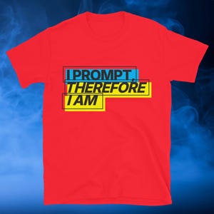 May include: A red t-shirt with the text "I PROMPT, THEREFORE I AM" in black, blue, and yellow. The text is arranged in a stacked format, with each word or phrase in a separate rectangular box.