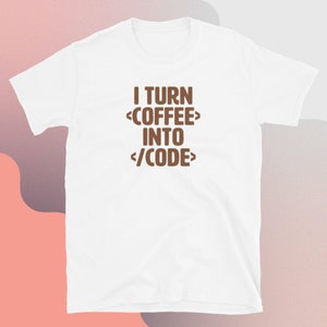 May include: White t-shirt with brown text that reads "I turn <coffee> into </code>"
