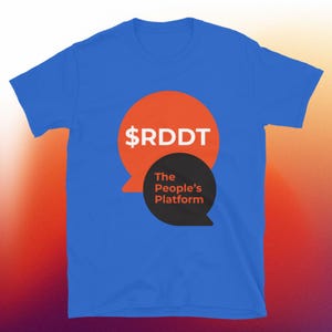 May include: A royal blue t-shirt featuring a graphic design. The design includes an orange speech bubble with the text "$RDDT" in white, and a black speech bubble with the text "The People's Platform".
