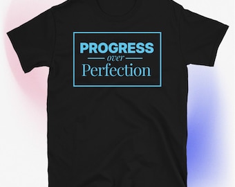 May include: Black t-shirt with a blue box that says "PROGRESS over Perfection" in white text.