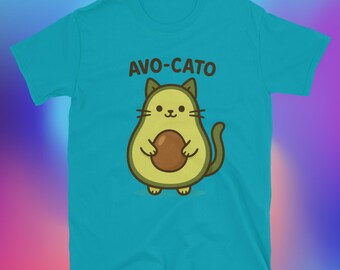 May include: A turquoise t-shirt featuring a cartoon avocado cat character. The avocado cat has a green body, brown seed, and cat-like features. The text "AVO-CATO" is printed above the character in brown letters.