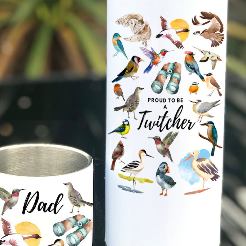 May include: White stainless steel tumbler featuring a colourful illustration of various birds and the text "Proud to be a Twitcher".