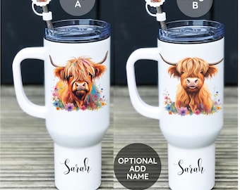May include: Two white travel mugs with a Highland Cow design. The mugs have a black lid and a stainless steel straw. The mug on the left has a colorful floral design around the cow. The mug on the right has a more simple floral design. Both mugs have the word "Sarah" printed on the bottom. The text "design A" is above the mug on the left and "design B" is above the mug on the right. The text "OPTIONAL ADD NAME" is below the mugs.