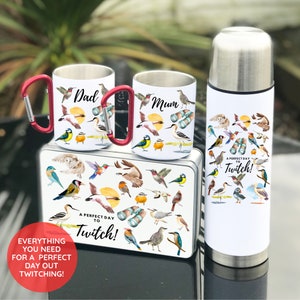 May include: A birdwatching gift set featuring a stainless steel flask, two mugs, and a lunchbox. The flask, mugs, and lunchbox all have a white background with colourful watercolour illustrations of birds and the text "A Perfect Day to Twitch!"