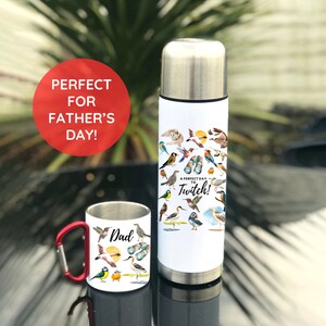 May include: A white stainless steel travel mug and a white stainless steel mug with a red handle. Both mugs feature a design of colourful birds and the text "A perfect day to Twitch!" The smaller mug has the word "Dad" on it.