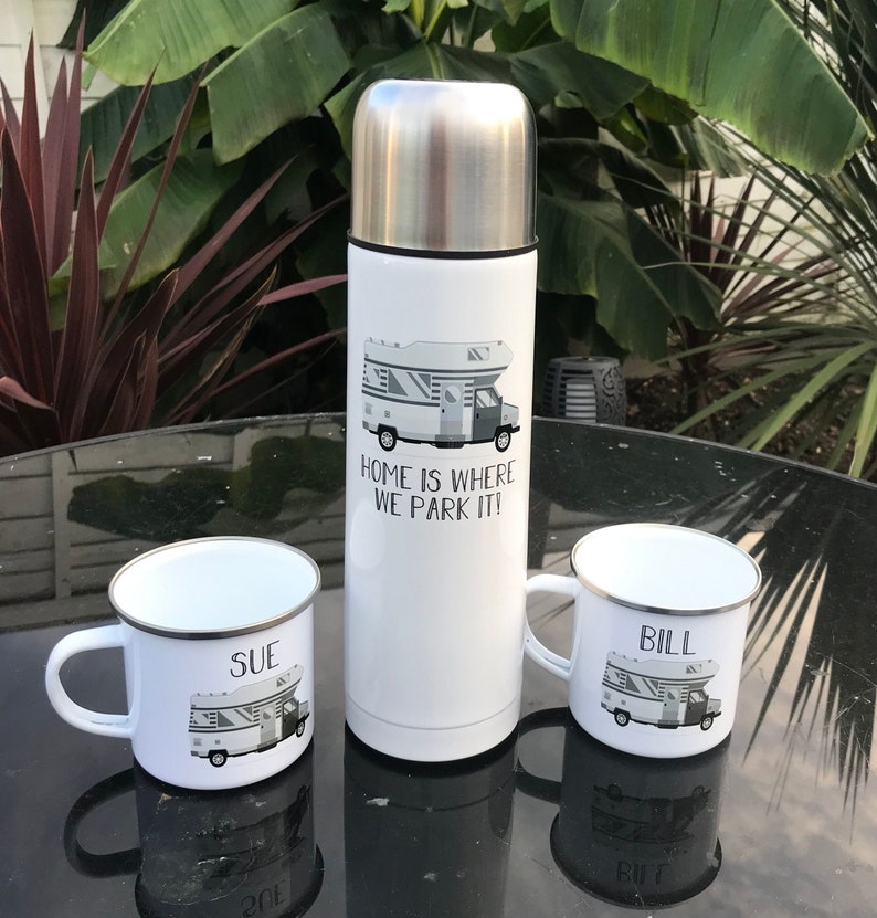 750ml thermos flask featuring graphic of motorhome with wording below 'Home is where we park it'. Also with 2 matching cups personalised with name.