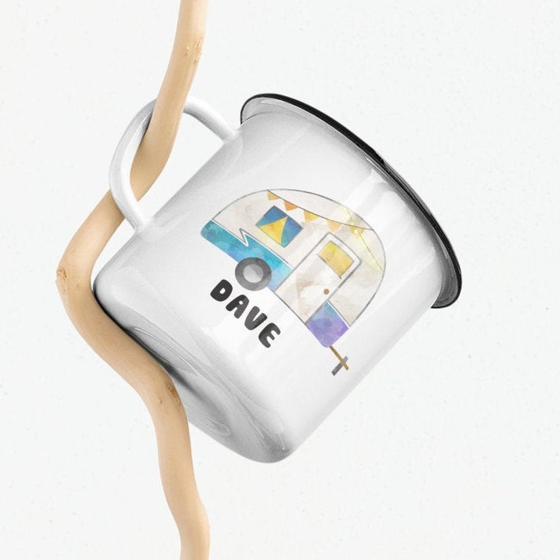 May include: White enamel mug with a black rim. The mug features a watercolor illustration of a blue and yellow camper van with the name "DAVE" printed below it.
