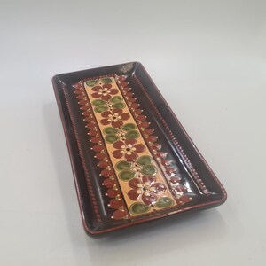 May include: A rustic wooden sign with the text "Welcome to our home" in white lettering. The sign features a distressed finish and a simple, inviting design, perfect for a front porch or entryway.