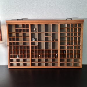 May include: A rustic wooden sign with the text "Welcome to our home" in white lettering. The sign features a distressed finish and a simple, inviting design, perfect for a front porch or entryway.