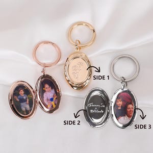 May include: Three oval-shaped photo locket keychains in rose gold, gold, and silver. Each locket opens to reveal a photo. The gold locket has a floral design. The silver locket has text inside.