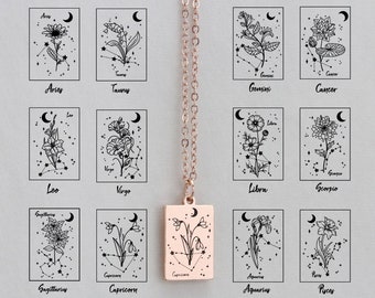 May include: A rose gold necklace with a rectangular pendant featuring a floral design and the word "Capricorn". The pendant hangs from a delicate chain, with zodiac signs and constellations in the background.
