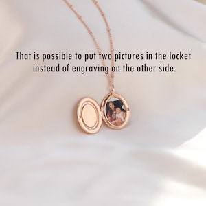 May include: A rose gold locket necklace with a photo of a woman and a child inside. The locket is open, revealing the photo.