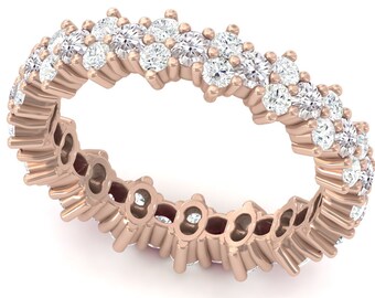 May include: A rose gold band with a staggered row of round brilliant diamonds.