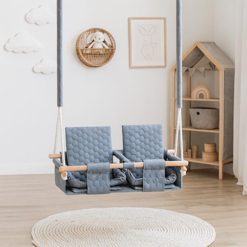 Waterproof twin swing in light grey, double seat with safety belts - product photo on a plain background
