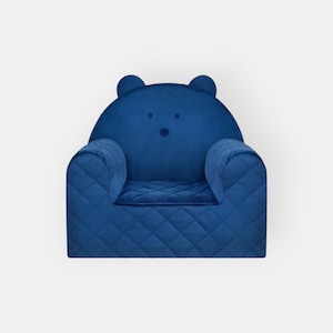 May include: A blue quilted armchair with bear ears and a bear face on the back. The chair is designed for children.