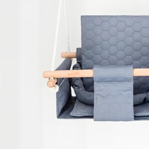 Waterproof twin swing in light grey, double seat with safety belts - close-up of the handmade craftsmanship