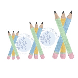 May include: Three sets of crossed pencils in different sizes. The pencils are yellow, light blue, and light green with pink erasers. The pencils are arranged in a circle with the text "Southern Sketch Embroidery Designs" in a blue circle with white leaves.